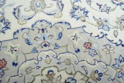 Close-up detail of 2000s Kashan rug from Iran / Persia showing Wool weave