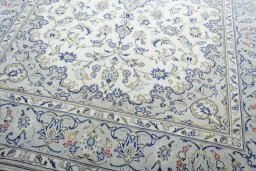 Close-up detail of 2000s Kashan rug from Iran / Persia showing Wool weave