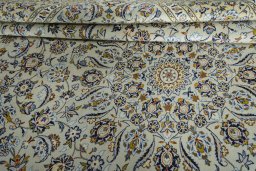 Close-up detail of 2000s Kashan rug from Iran / Persia showing Wool weave