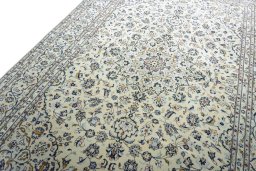 Backside of handmade New Kashan rug showing knot structure and weave density