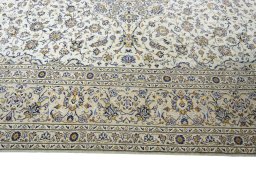 Corner detail of New Kashan rug showing border pattern and Wool pile