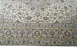 Corner detail of 2000s Kashan rug showing border pattern and Wool pile
