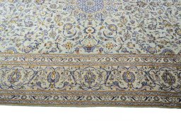 Corner detail of 2000s Kashan rug showing border pattern and Wool pile