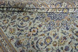 Close-up detail of 2000s Kashan rug from Iran / Persia showing Wool weave