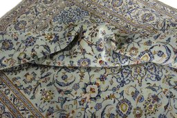 Surface texture of 2000s Kashan rug with natural Wool and intricate pattern