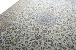 Backside of handmade 2000s Kashan rug showing knot structure and weave density
