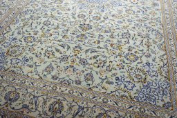 Close-up detail of 2000s Kashan rug from Iran / Persia showing Wool weave