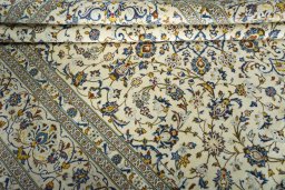 Close-up detail of New Kashan rug from Iran / Persia showing Wool weave