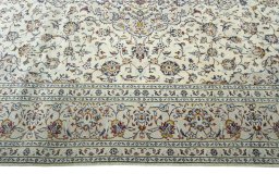 Corner detail of New Kashan rug showing border pattern and Wool pile