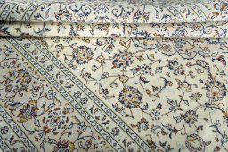 Close-up detail of New Kashan rug from Iran / Persia showing Wool weave