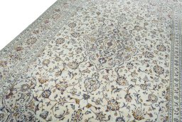 Backside of handmade New Kashan rug showing knot structure and weave density