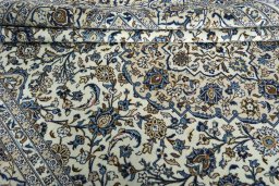Close-up detail of 2000s Kashan rug from Iran / Persia showing Wool weave