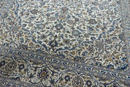 Close-up detail of 2000s Kashan rug from Iran / Persia showing Wool weave