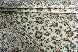 Close-up detail of 2000s Kashan rug from Iran / Persia showing Wool weave