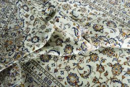 Surface texture of 2000s Kashan rug with natural Wool and intricate pattern
