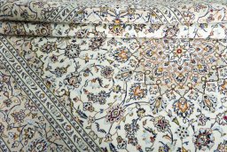 Close-up detail of 2000s Kashan rug from Iran / Persia showing Wool weave