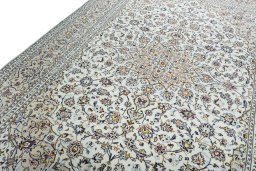 Backside of handmade 2000s Kashan rug showing knot structure and weave density