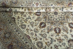 Close-up detail of 2000s Kashan rug from Iran / Persia showing Wool weave