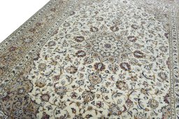 Backside of handmade 2000s Kashan rug showing knot structure and weave density