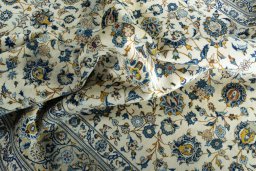 Surface texture of 2000s Kashan rug with natural Wool and intricate pattern