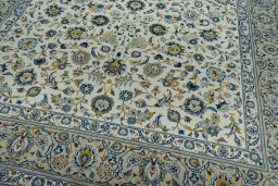 Close-up detail of 2000s Kashan rug from Iran / Persia showing Wool weave