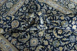 Surface texture of 2000s Kashan rug with natural Wool and intricate pattern