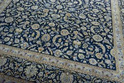 Close-up detail of 2000s Kashan rug from Iran / Persia showing Wool weave