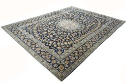 Corner detail of 2000s Kashan rug showing border pattern and Wool pile