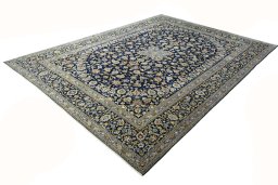 Corner detail of 2000s Kashan rug showing border pattern and Wool pile