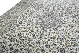 Backside of handmade New Kashan rug showing knot structure and weave density