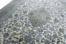 Backside of handmade 2000s Kashan rug showing knot structure and weave density