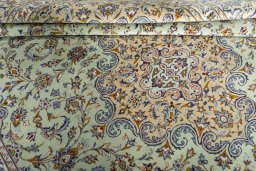 Close-up detail of 2000s Kashan rug from Iran / Persia showing Wool weave
