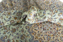 Surface texture of 2000s Kashan rug with natural Wool and intricate pattern