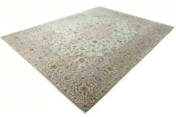 Corner detail of 2000s Kashan rug showing border pattern and Wool pile