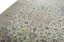 Backside of handmade 2000s Kashan rug showing knot structure and weave density