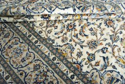 Close-up detail of New Kashan rug from Iran / Persia showing Wool weave