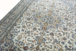 Backside of handmade New Kashan rug showing knot structure and weave density