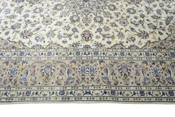 Corner detail of New Kashan rug showing border pattern and Wool pile
