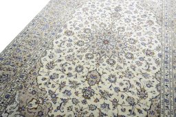 Backside of handmade New Kashan rug showing knot structure and weave density