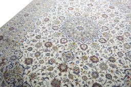 Backside of handmade 2000s Kashan rug showing knot structure and weave density