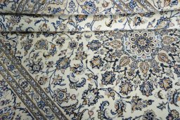 Close-up detail of 2000s Kashan rug from Iran / Persia showing Wool weave