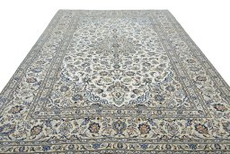 Surface texture of 2000s Kashan rug with natural Wool and intricate pattern