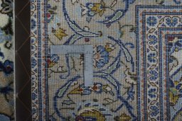 Central medallion detail of 2000s Kashan rug from Iran / Persia