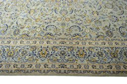 Corner detail of 2000s Kashan rug showing border pattern and Wool pile