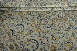 Close-up detail of 2000s Kashan rug from Iran / Persia showing Wool weave