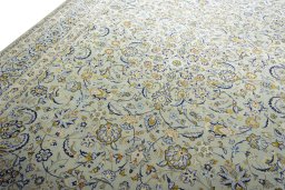 Backside of handmade 2000s Kashan rug showing knot structure and weave density