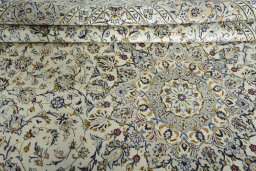 Close-up detail of 2000s Kashan rug from Iran / Persia showing Wool weave