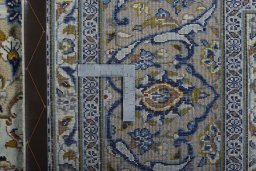 Backside of handmade 2000s Kashan rug showing knot structure and weave density