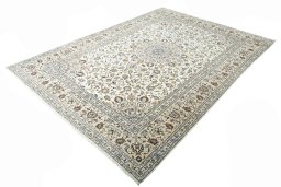 Corner detail of 2000s Kashan rug showing border pattern and Wool pile