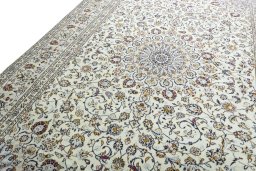 Backside of handmade 2000s Kashan rug showing knot structure and weave density